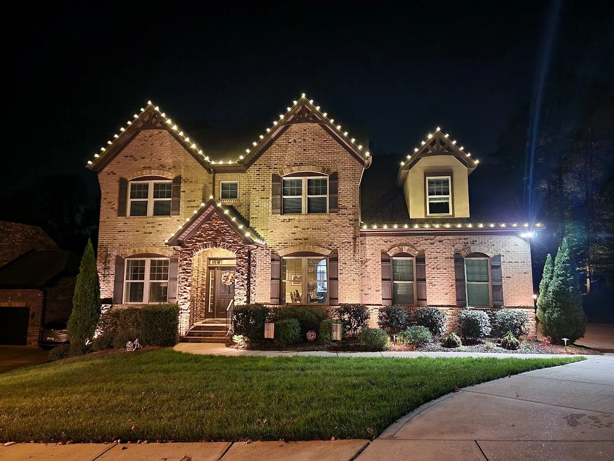 Warm white Christmas lighting on a Charlotte-area home