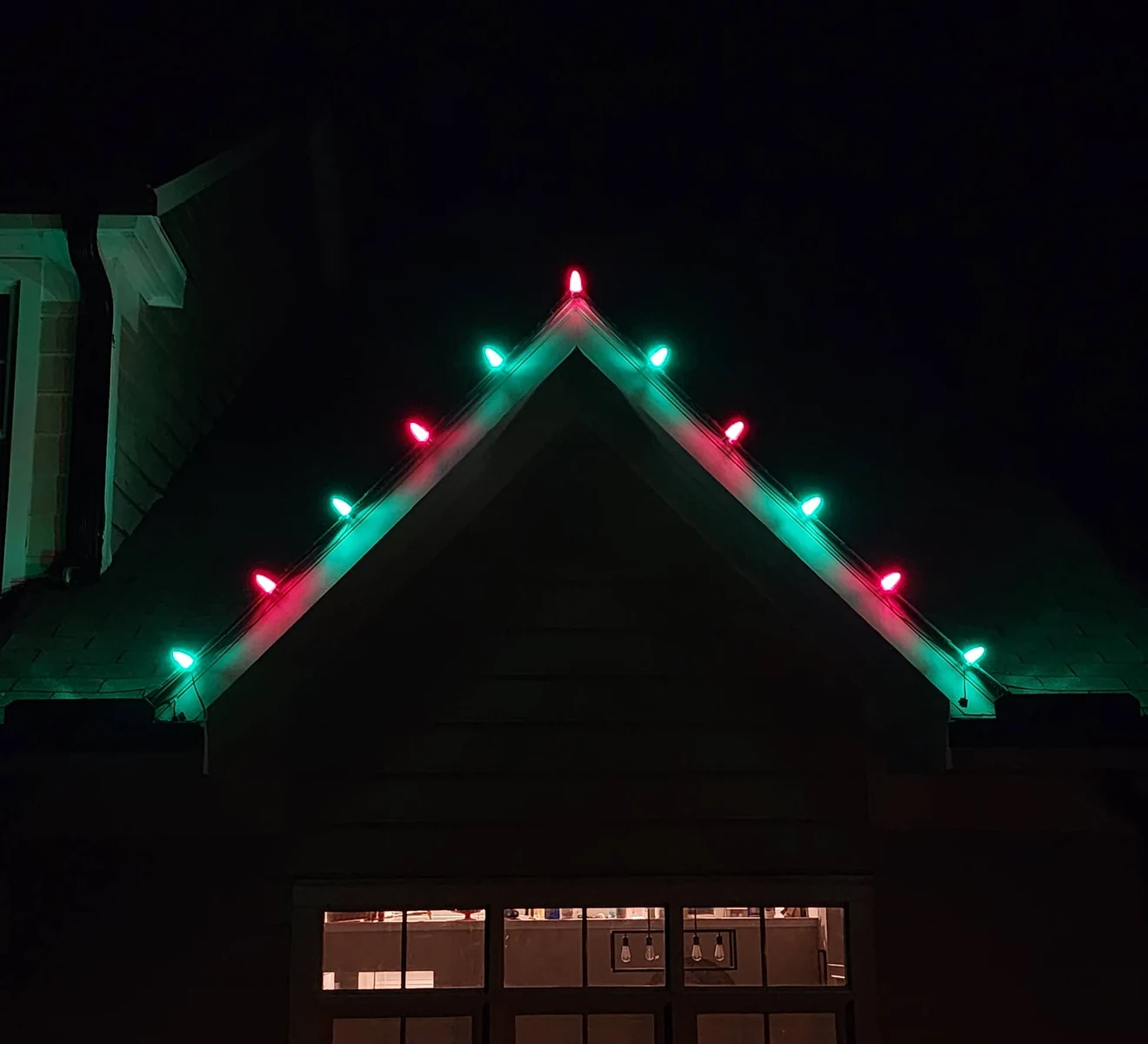 Red and green bulbs along the same gable